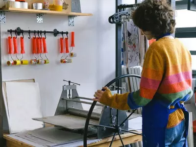 woman next to printing machine