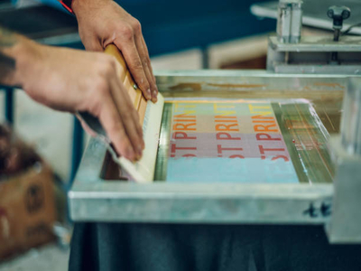When screen printing t-shirts, only one color is printed at a time.